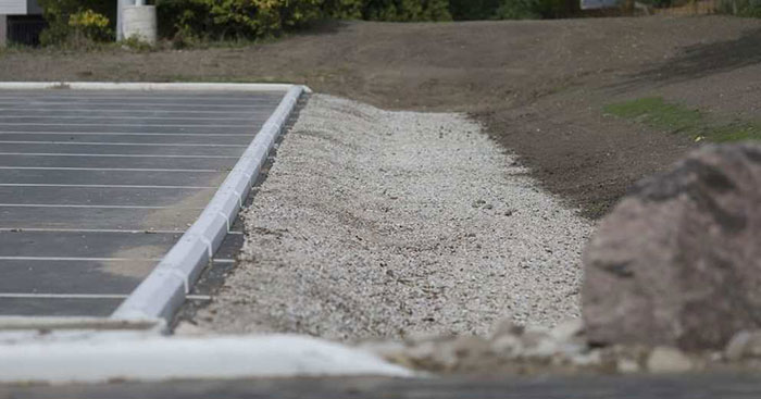 A newly constructed infiltration trench is pictured in the parking lot of the South Windsor Arena on Sept. 12, 2017.